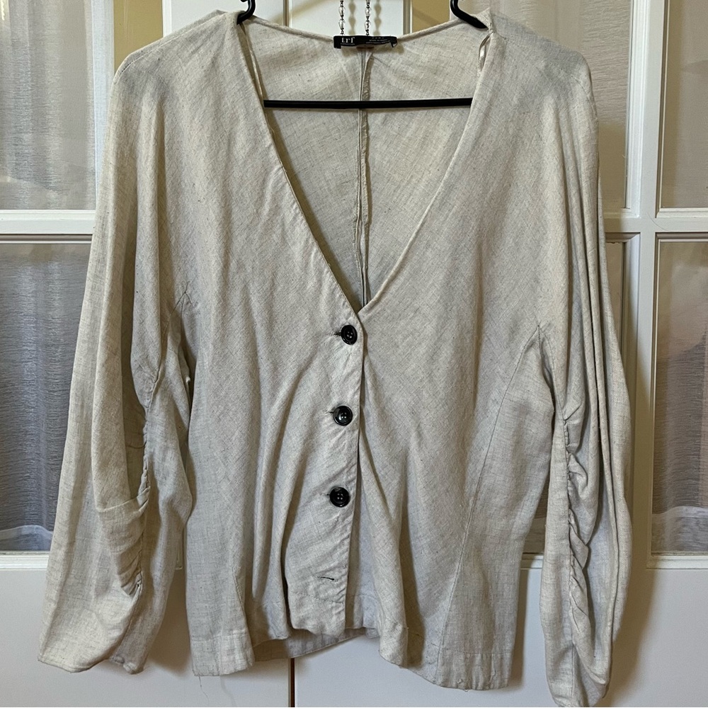 Tan linen button up long sleeve shirt with deep v neck